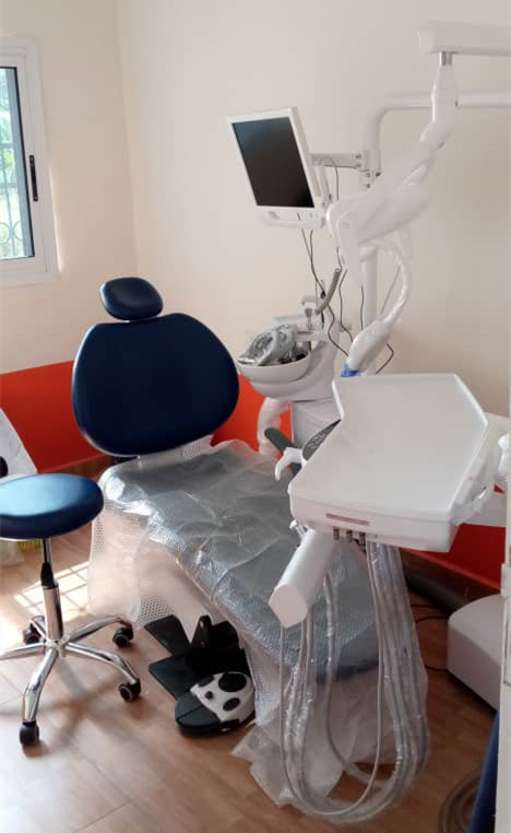 Professional installation of a dental chair with fully configured water and air lines.
