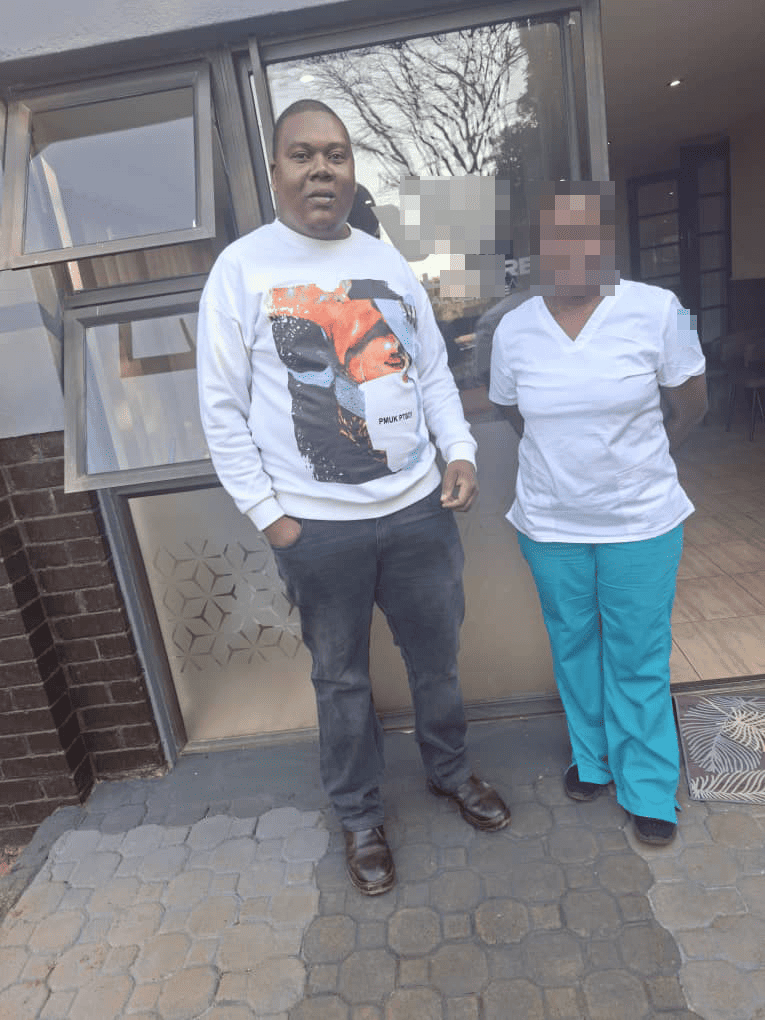 MECANMED local service engineer with healthcare staff during an on-site visit in Zimbabwe.