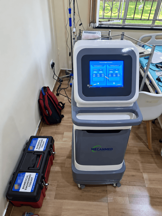 MECANMED TMS machine powered on at a healthcare facility after installation and commissioning.